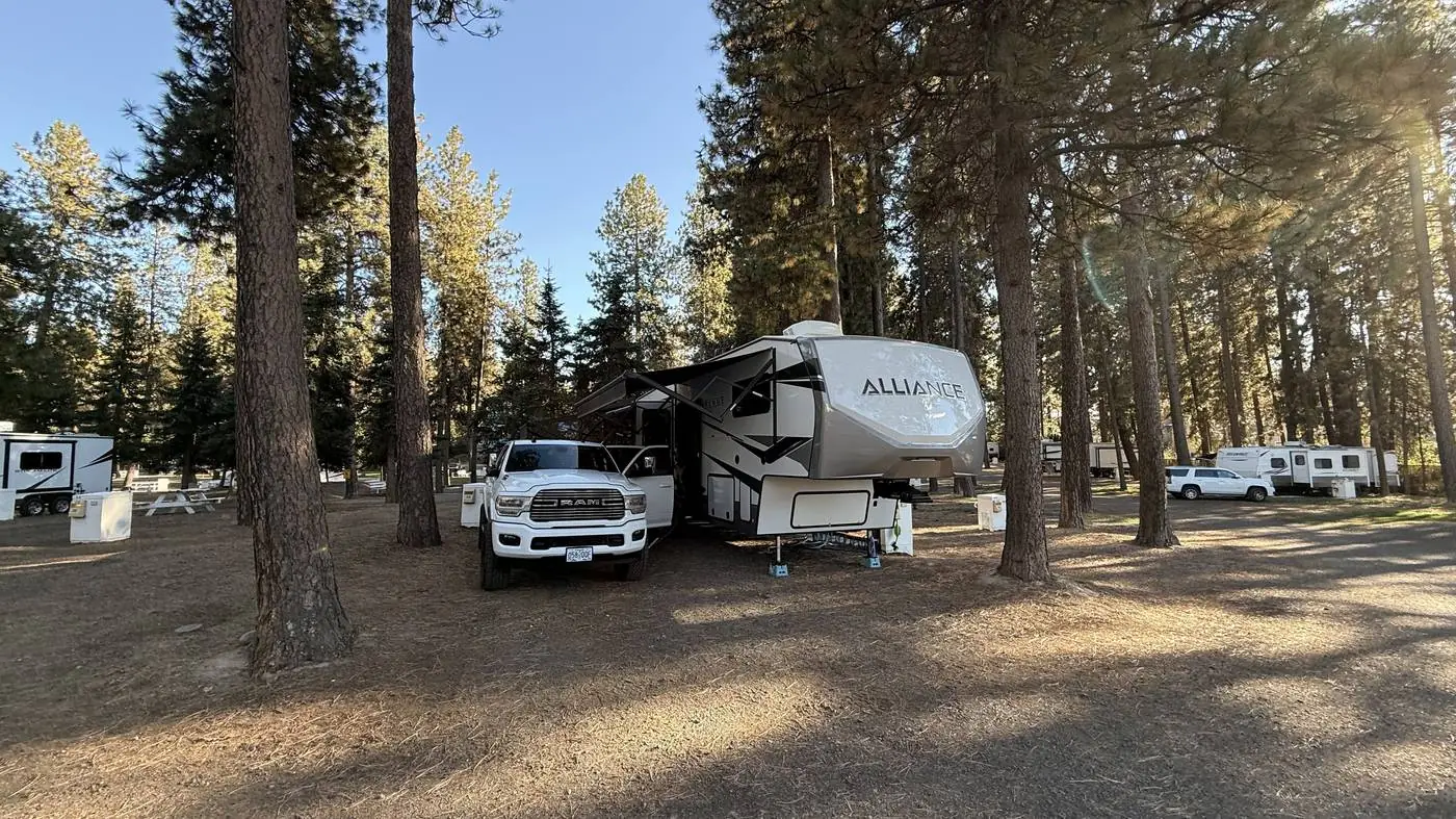Truck towing the Alliance fifth wheel at a mountain overlook